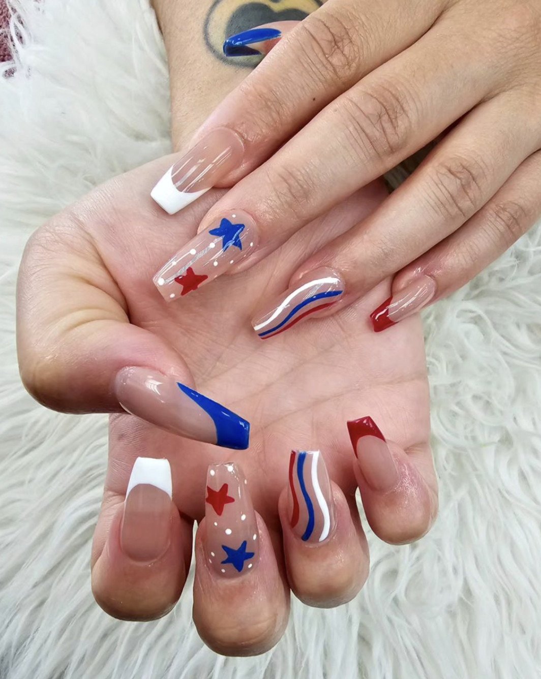 13 Subtle Fourth of July Nails That'll Make You the Star of the Celebration! - 4. Floral Accents on a Red Background