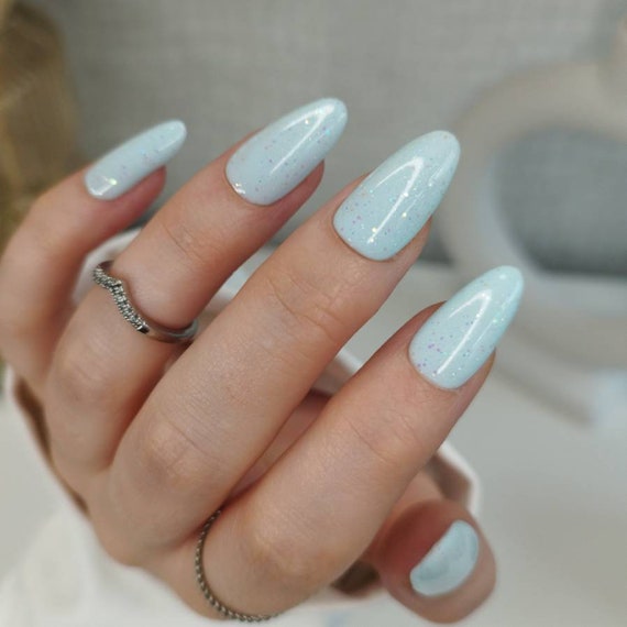 Icy Blue Nails Winter: 14 Irresistible Designs You Can't Miss! - Glitter Ombre: A Sparkly Fade